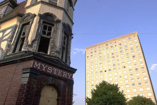 The burnt-out shell of the Mystery Pub in Somerstown with Tipton House in the background.