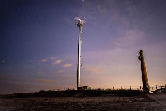 Sky shot taken at night at Eastney, with a boat finding radar and an old chimney by Sean Finch.