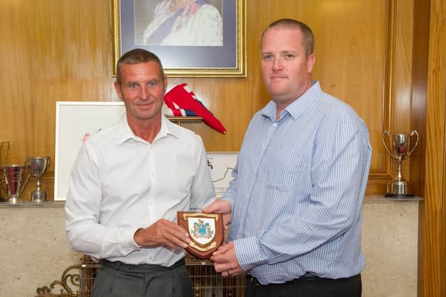 Rescuers Gary Crook and Andy Birch with the Portsmouth City Council shield they were awarded by lord mayor David Fuller. Picture: Habibur Rahman