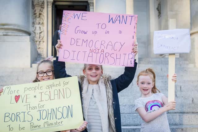 Hundreds of protesters descend on Guildhall Square to protest the prorogation of Parliament by prime minister Boris Johnson. Pictured: Isla, eight, Bella, eight, and Ava, six. Picture: Habibur Rahman