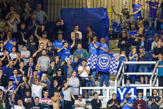 The  Fratton faithful celebrate Pompey's Carabao Cup second-round win at QPR. Picture: Nigel Keene