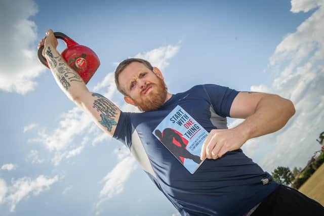 Dan Fallon pictured with his book near Southsea Castle, Southsea .

Picture: Habibur Rahman