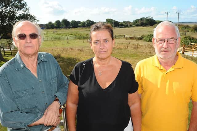 Residents Richard Platt, 74, Eleanor Newman, 52, and Ray Rowsell, 74, overlooking the proposed caravan park site from Eleanor's house. Picture: Sarah Standing