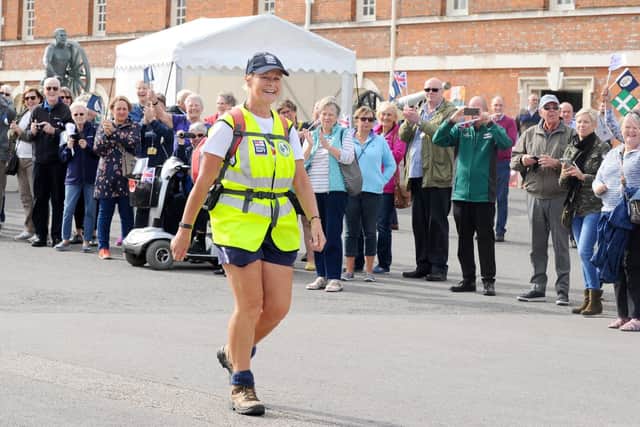 Jane Allen returned to Portsmouth Historic Dockyard on Friday, September 6, after completing her Victory Walk from Portsmouth in October 2017 to walk anti-clockwise around the coastline of mainland Britain in aid of the Royal Navy and Royal Marines Charity (RNRMC) and Womens Royal Naval Service Benevolent Trust (WRNS BT).  Picture: Sarah Standing (060919-6617)