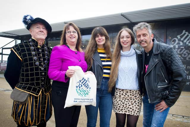 Pictured : Bob Meredith dressed as Vice Admiral Sir George Carew with chief executive Helen Bonsor-Wilton presenting visitors, Sue Pope, her daughter Rosanna and Sue's husband, Colin Pope with a gift bag outside the Mary Rose Museum, Portsmouth.

Picture : Habibur Rahman