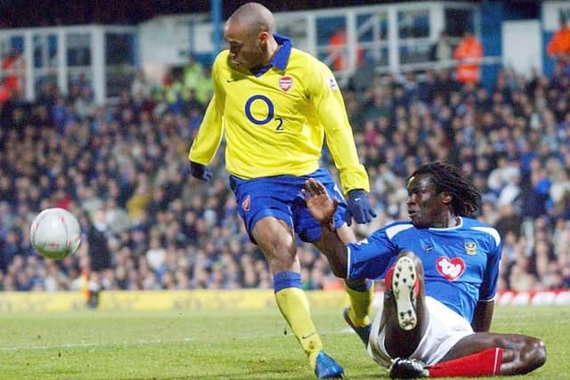 Linvoy Primus deals with Thierry Henry in 2004. PA Photo: Sean Dempsey