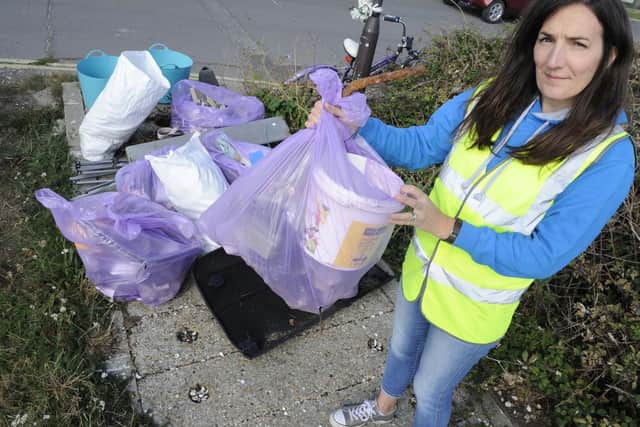 Lissie Pollard with piles of rubbish. Picture: Ian Hargreaves (070919-8)