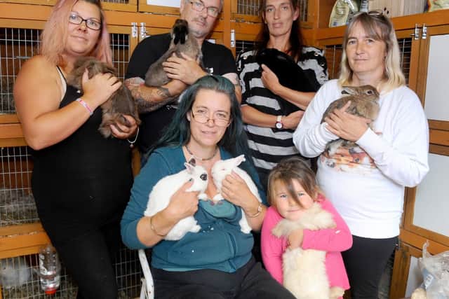 Back left to right, Kimmie Bray, Steve Sheehan, Vanessa Taylor, Louise Sheehan with front left to right, Franceska Dante and Bethany Hamling (4), who help out at South Coast Rabbit Rescue. Picture: Sarah Standing (120919-5865)