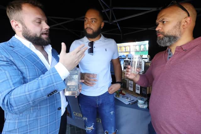 From left, Wrecking Coast Distillery's Tomas Cisty, Wesley Vali and Hadley Schoeman at the Gin Festival, Gunwharf Quays. Picture: Chris Moorhouse     (140919-35)