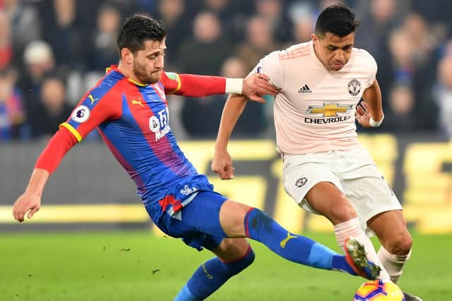 Crystal Palace's Joel Ward tackles Manchester United's Alexis Sanchez. Picture: OLLY GREENWOOD/AFP/Getty Images