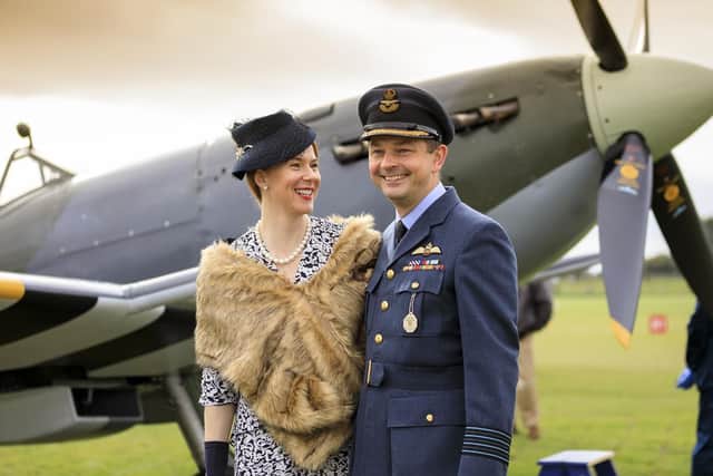 A couple dressed in period clothing pictured at the Goodwood Revival.