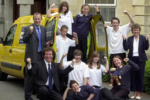 Mayfield School headteacher Derek Trimmer with students after the school received a donation in 2005.