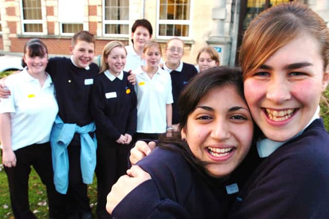 Lorin Sulaiman (14) receives a welcome back hug from best friend Sharon Thomas (14) watched by school friends, Kirsty Squires, Joshua Breach, Jess Randle, Tom Ross, Sarah Monnier, Katie Newell and Kirsty Elstone outside Mayfield School in 2004