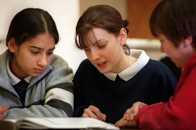 Mary Carrigan who was then head of maths at Mayfield School in North End gives after hours tuition to (left), Bhajan Sohel and Vanessa Ward who are both fifteen in March 1999.