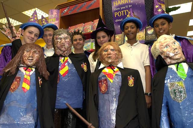 Mayfield School pupils take Harry Potter mannequins to Ottakers bookshop (left to right), Paul Wright (14), Ollie Dowdeswell (14), Alan Todd (13), Gemma Taylor (14), Samsul Chowdhury (14), and Subir Uddin (14) in 2003.