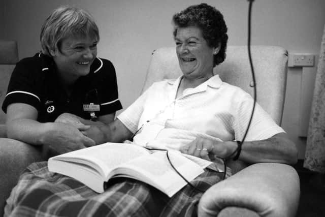 Ward sister Brenda Dillon checks all is well with leukaemia patient Daphne Cuff in September 1995