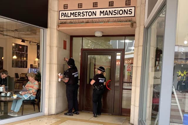 Police entering Palmerston Mansions in Palmerston Road, Southsea.