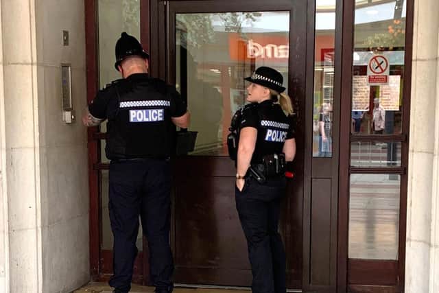Police entering Palmerston Mansions in Palmerston Road, Southsea.