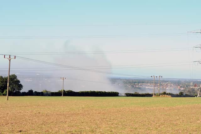 Smoke billowing up from the Veolia waste transfer station.
Picture: Sarah Standing (170919-7568)