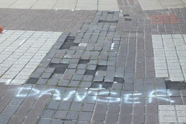Some of the graffiti in London Road, Waterlooville, carried out by Malcolm Garbutt - after he witnessed three elderly women tumble on uneven bricks. Picture: Malcolm Garbutt