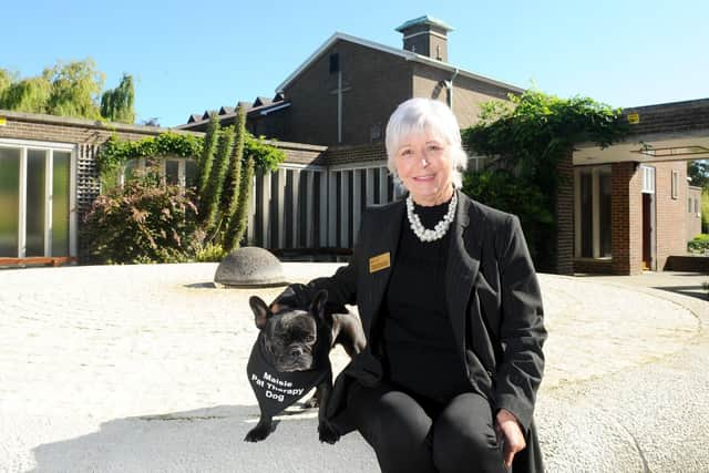 Celebrant Philippa Hawkins from Fareham, has a very special helper at funerals - her French bulldog, Maisie (4). Maisie is a funeral therapy dog, who comforts people during services. Picture: Sarah Standing (170919-6390)