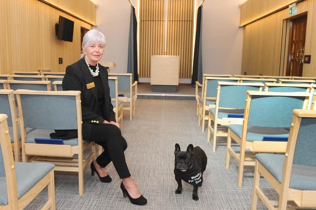 Celebrant Philippa Hawkins from Fareham, has a very special helper at funerals - her French bulldog, Maisie (4). Maisie is a funeral therapy dog, who comforts people during services. Picture: Sarah Standing (170919-6299)