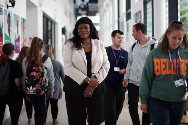Stella Mbubaegbu, principal of Highbury College, pictured in June 2018 at the college in Cosham with students. Picture: Chris Moorhouse