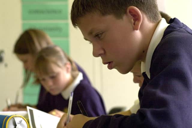 St Luke's pupils hard at work in 2000 during an RE class under the guidance of their teacher Sue Whewell