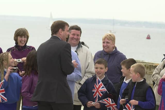 Prince Andrew talking to children from St Luke's School, in on the Millenium promenade, Old Portsmouth in 2001.