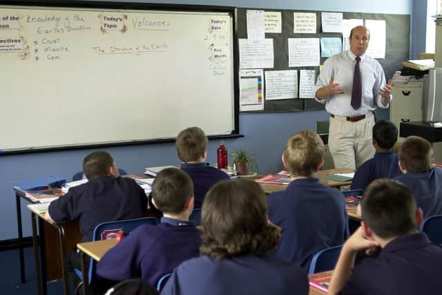 Dave Carson teaches a year 8 class about volcanoes in a Geography class at St Luke's School in 2004.
