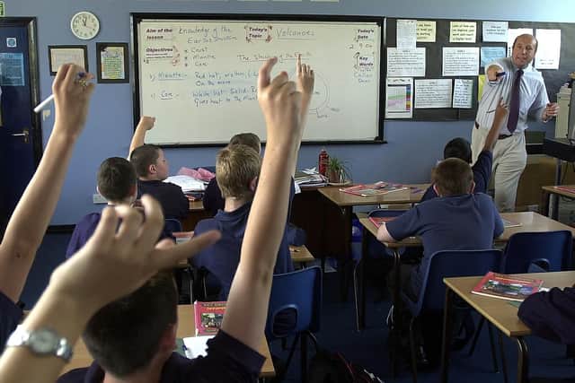 Dave Carson teaches a year 8 class about volcanoes in a Geography class at St Luke's School in 2004.