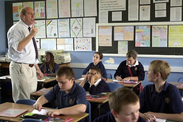 Dave Carson teaches a year 8 class about volcanoes in a Geography class at St Luke's School in 2004.