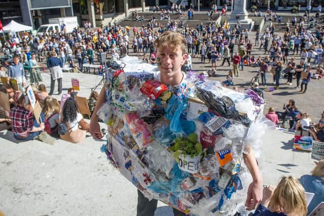 Adam Timpson raising awareness dressed as litter. Picture: Habibur Rahman