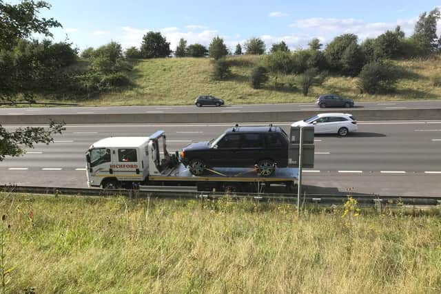 The broken down Landrover being recovered