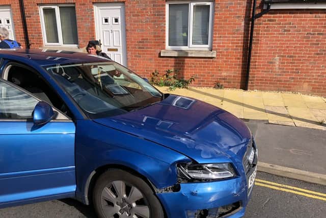 Police at the scene of a crash in Knowsley Road, Cosham, in Portsmouth at around 9.40am. The driver of a blue Audi involved in the crash was seen 'running' away from the scene, police said. Picture: Richard Lemmer