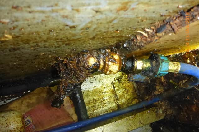 Photo shows filthy conditions beneath the wok range. Panda Chinese in The Square, Wickham, was inspected by Winchester City Council which found filthy conditions. Its owner and operator were prosecuted at Portsmouth Magistrates' Court. Picture: Winchester City Council