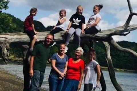 Helen Stiller, bottom row second-left, with family members including her son Jack, top-left, who is eight, and her daughter Jessica, top-right, who is 10. Picture: Helen Stiller