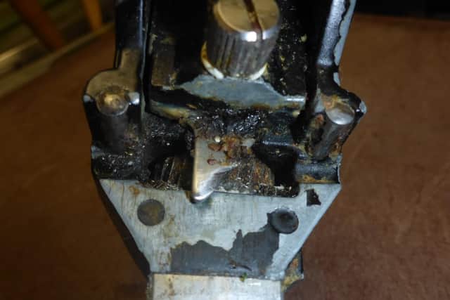 Photo shows a disgusting can opener.