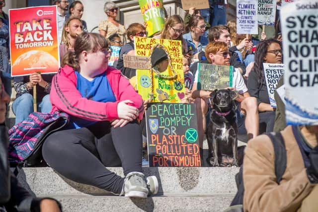 Climate change protesters holding placards in Portsmouth.

Picture: Habibur Rahman