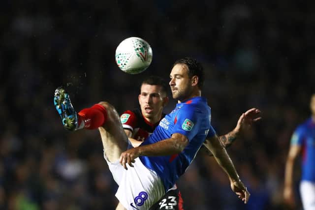 Brett Pitman plays a pass