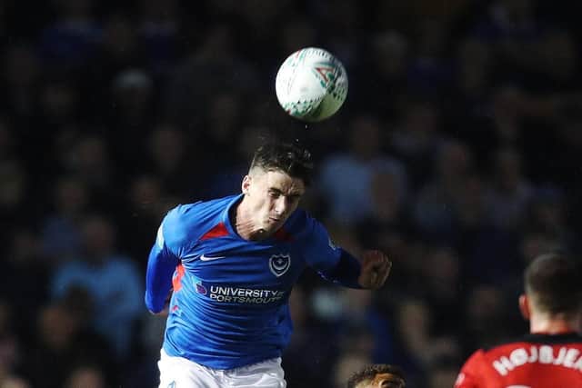Oli Hawkins climbs to win a header