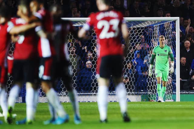 Pompey keeper Craig MacGillivray looks disappointed after Danny Ings' second goal    Picture: Joe Pepler