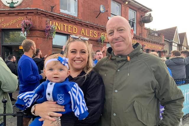 Gavin King,48, right, with his daughter Toni King, 26, and her six-month-old child Harper-Rose, who is attending her first south coast derby.