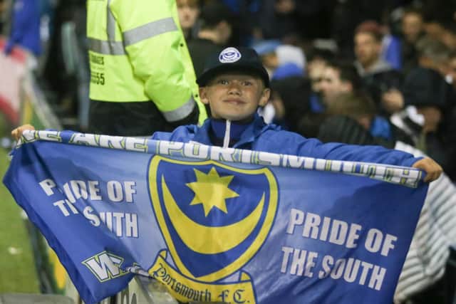 Young Pompey fan with 'Pride of the South' flag at Fratton Park last night