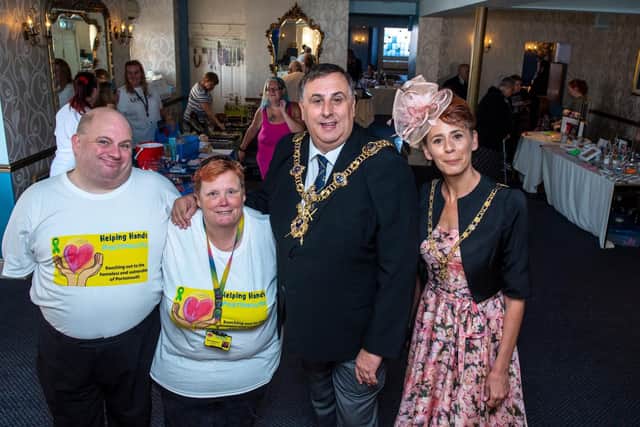 Charity Fete And Disco For Helping Hands in Portsmouth at The Royal Beach Hotel in Southsea - from left, volunteer Darren Peat, Bev Saunders (the Helping Hands Founder) and the Lord Mayor and Lady Mayoress of Portsmouth. Picture: Vernon Nash (210919-006)