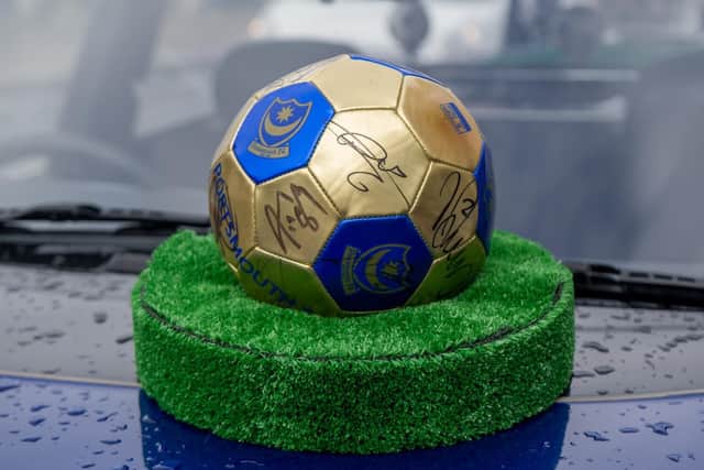 27/9/19Story: North End Funeralcare are have a Macmillan coffee morning with the EFL Trophy.Pictured : A signed ball from the 2008 FA game on top of the hearse.Picture : Habibur Rahman