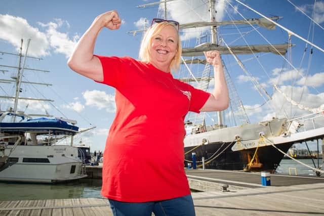 Cheryl Spencer celebrates returning back to dry land after a seven day voyage on-board the Lord Nelson.