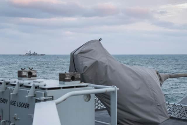Pictured: Royal Navy Offshore Patrol Vessel HMS Mersey shadows Russion warship Yaroslav Mudryy.