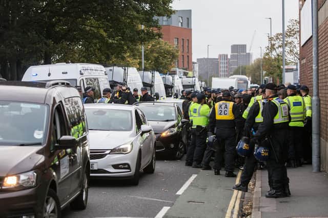 Pompey vs Saints at Fratton Park.Pictured: Southampton fans being escorted by police at Goldsmith Avenue, Portsmouth. Picture: Habibur Rahman