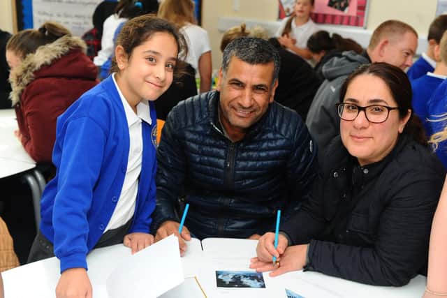 Hana Shukr, 8, with her parents Kirem and Suzan Shukr.
Picture: Sarah Standing
